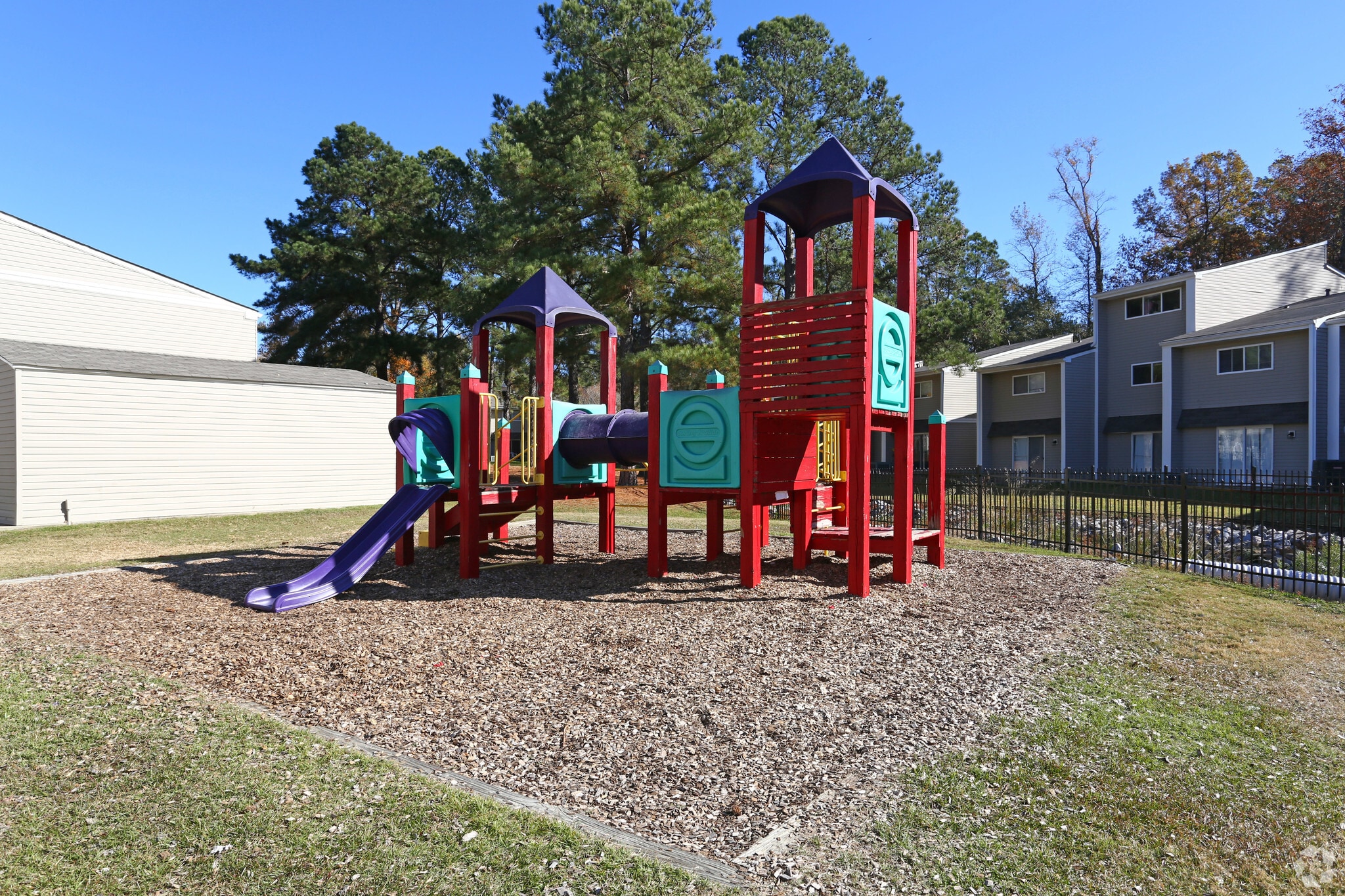 Outdoor childrens playground at Austin Woods Apartments, located in Columbia, SC