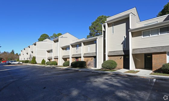 exterior building and parking at Austin Woods Apartments, located in Columbia, SC